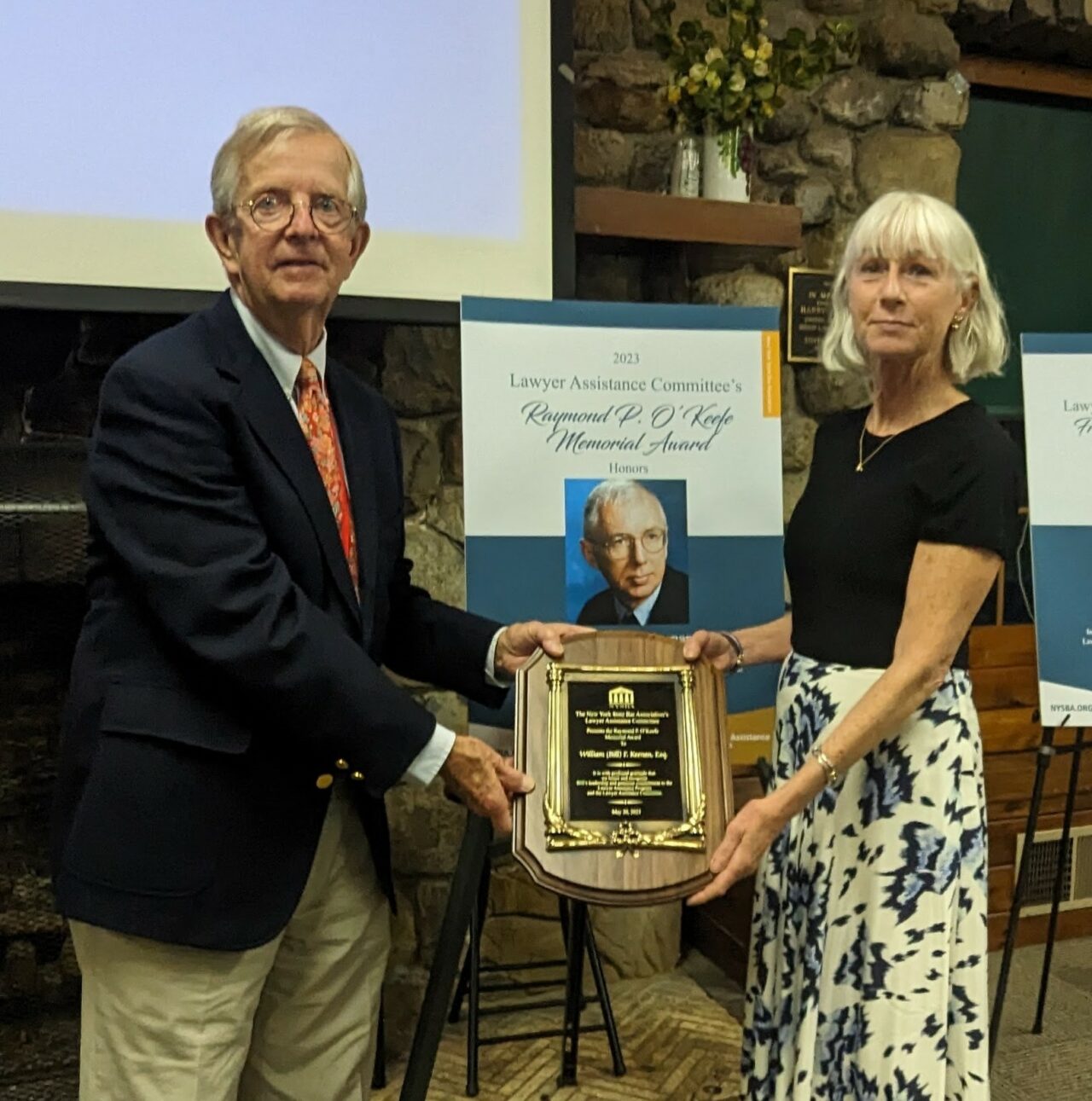 David Pfalzgraf, former chair of the Lawyer Assistance Committee, presented the Raymond P. O’Keefe award to Mary Clare Keenan, who accepted in honor of her father Bill Keenan.